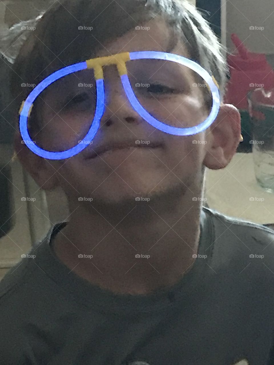 Glow stick eyeglasses on young boy.