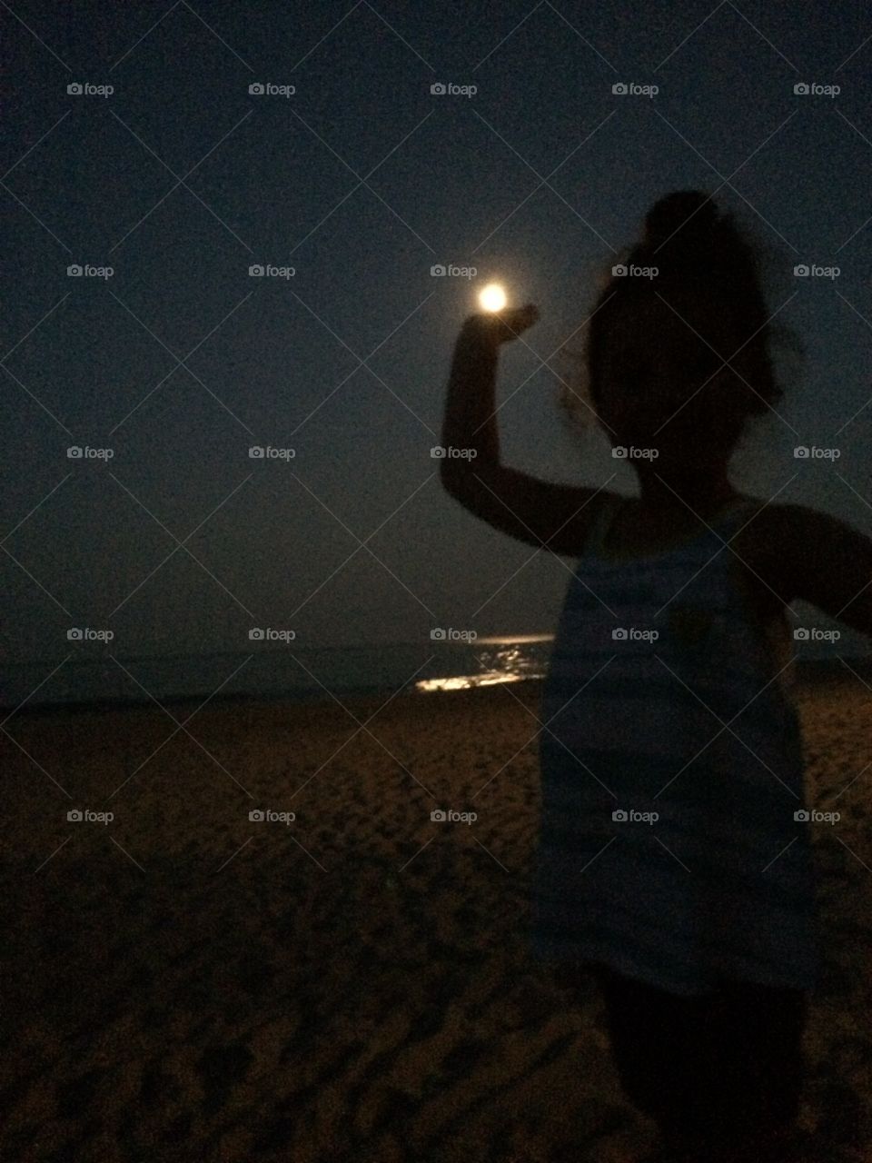 Capture the moon by the ocean