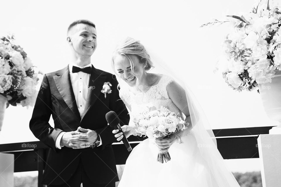 Bride laughing at wedding ceremony