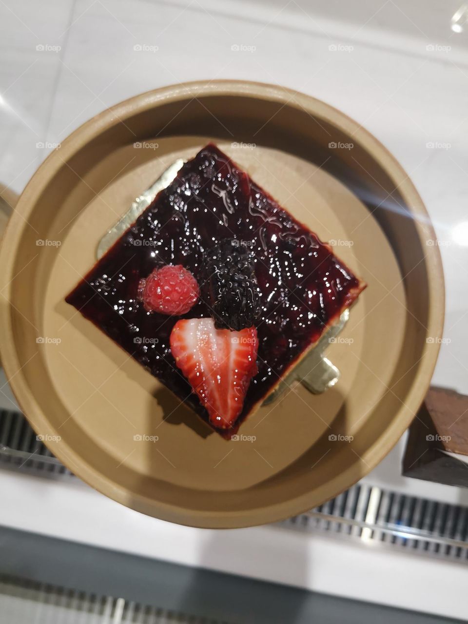 Delicious strawberry cake with black coffee