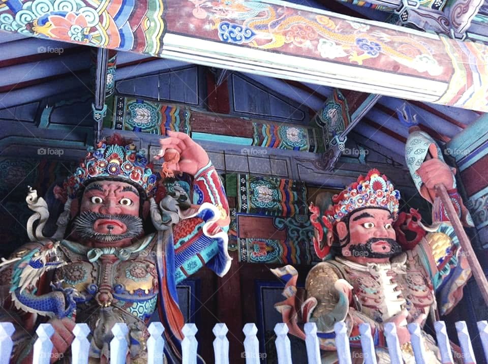 Traditional Multi-coloured Wooden Statues in a Temple, South Korea