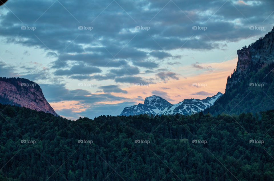 Cloudy sky over mountain range