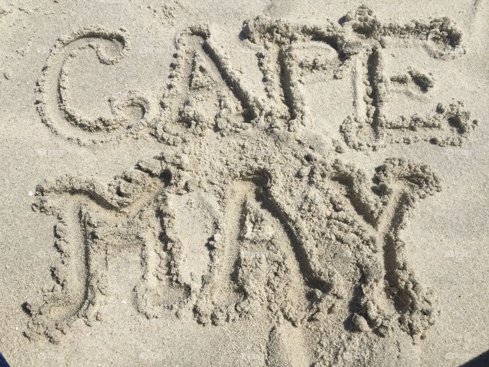 Draw in the sand . Hand drawing in sand at Cape May, NJ