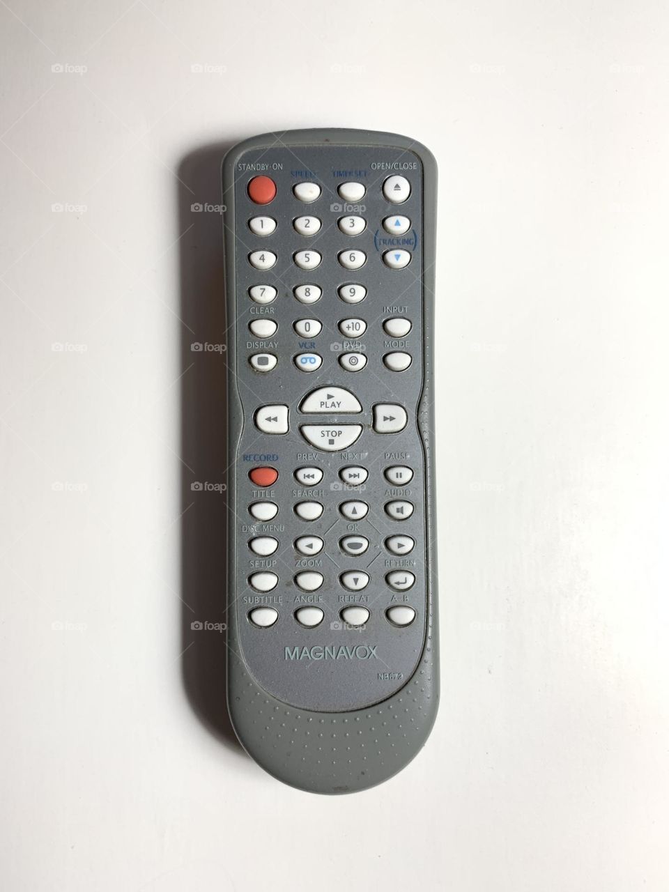 Magnavox remote control in white background.