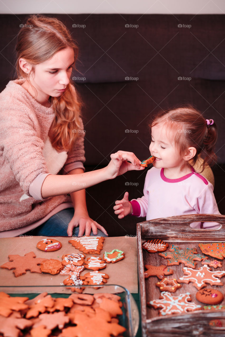 Mother and daughter with gingerbread cookies
