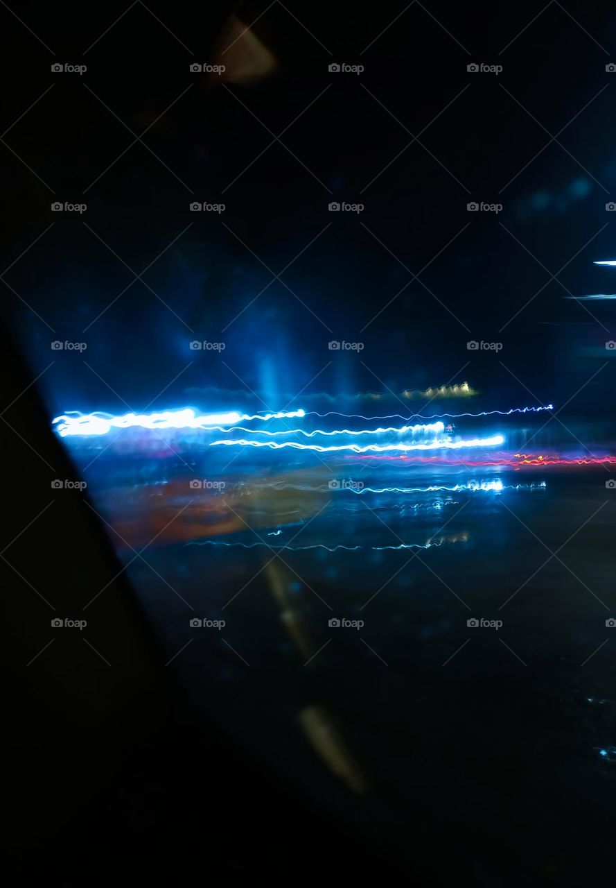 City night lights perspective blurred by high speed of the car. Abstract City night lights. Background and texture.