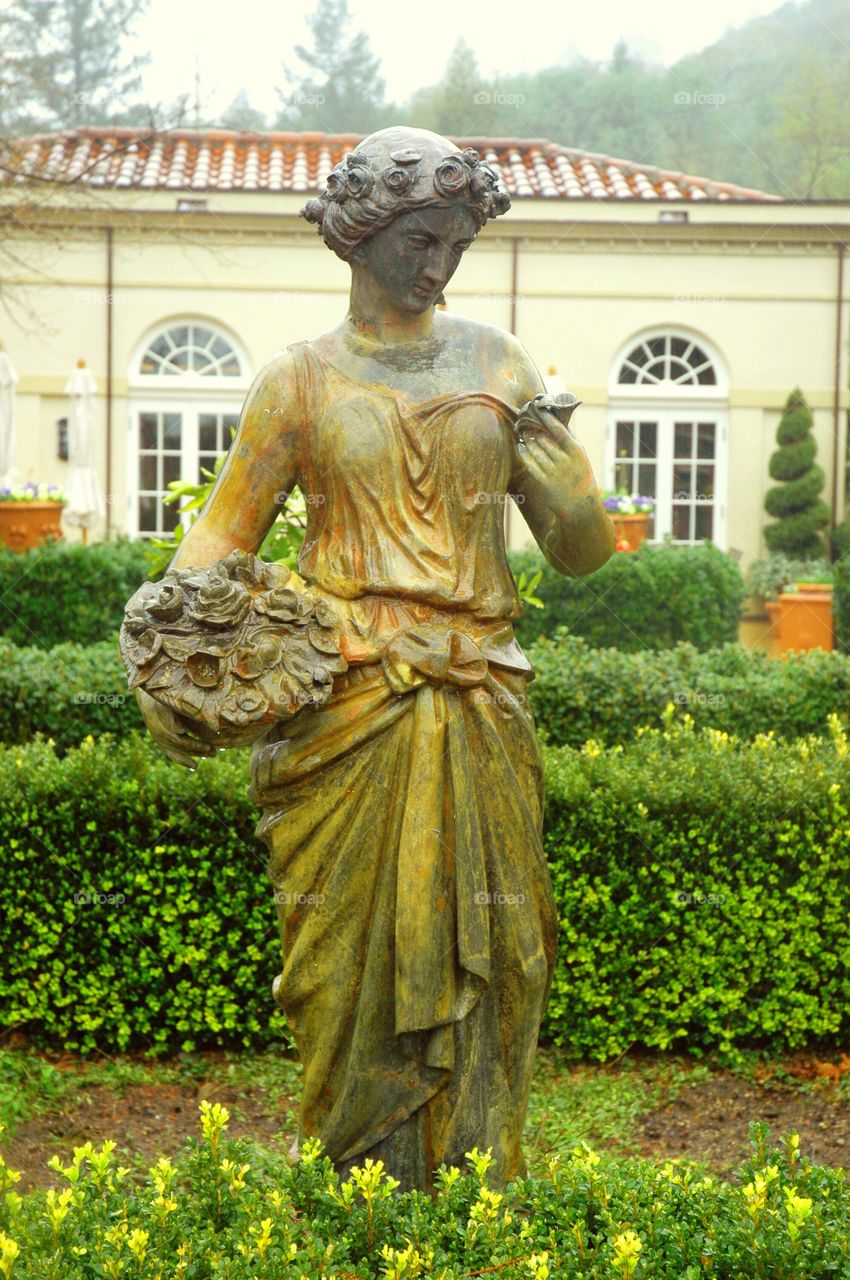 Statue. Statue of a female in a garden.