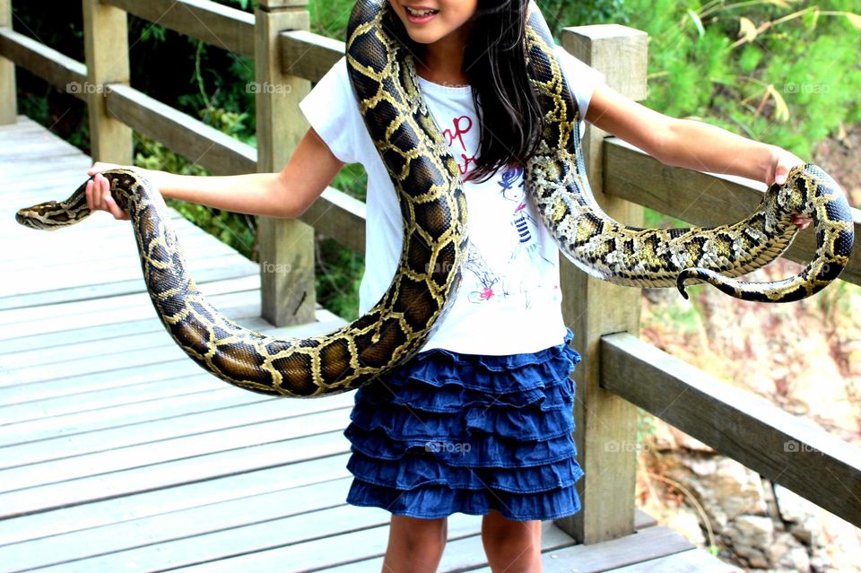 Girl playing with snake