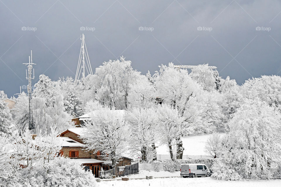 House in snowing mountain 