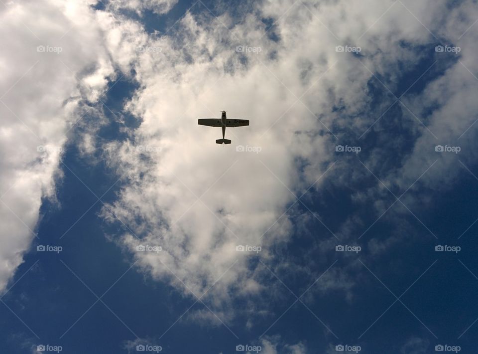 Aeroplane on the sky with clouds.
