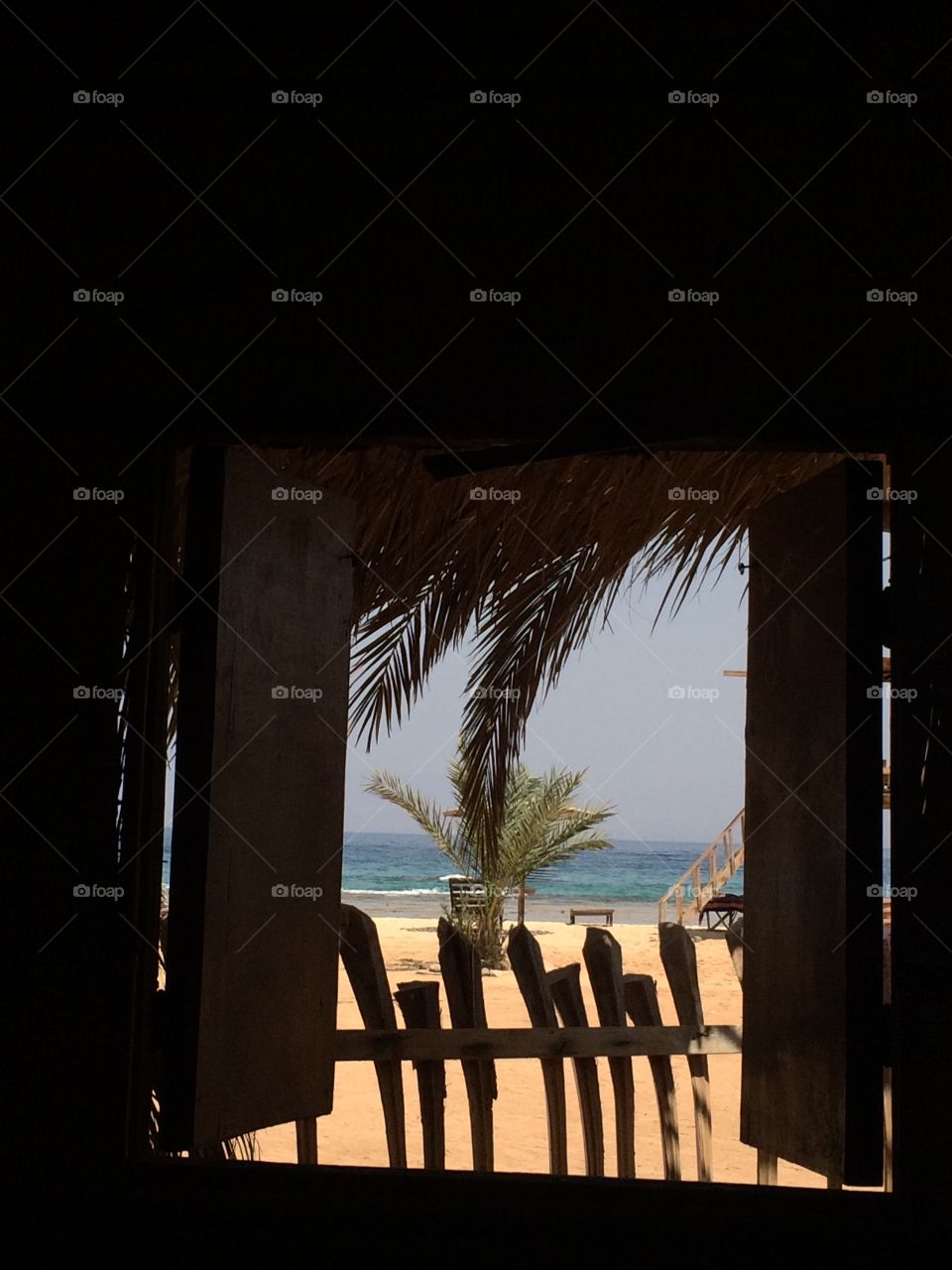 A view of the sea from inside a cabinet