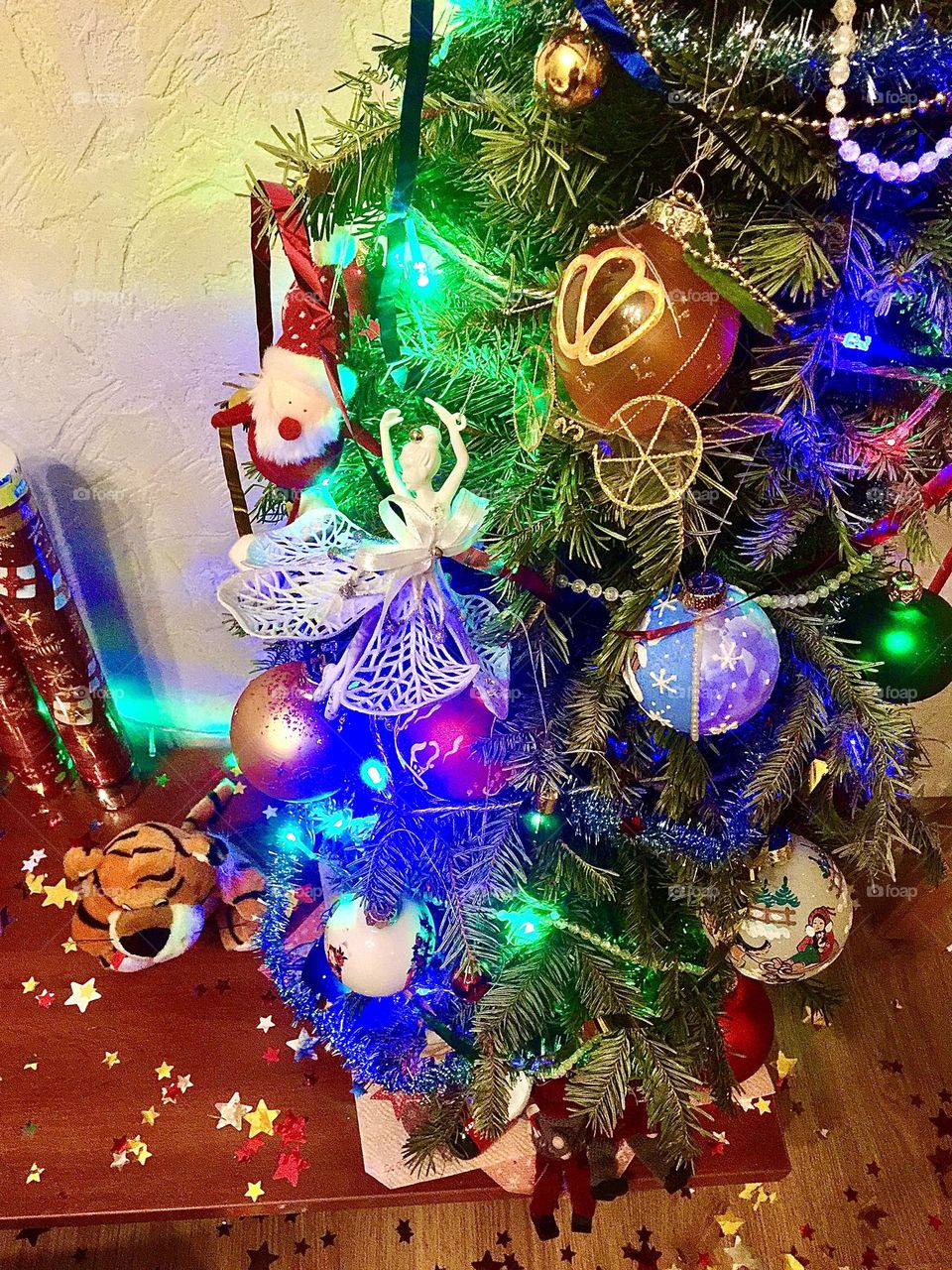 Small New Year's tree with toys and clapper