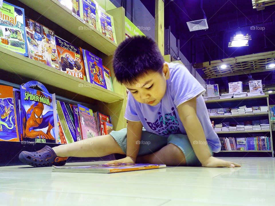 boy child studying bookstore by junpinzon