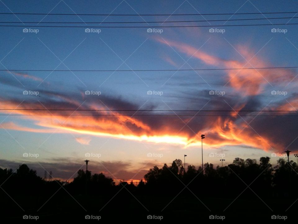 Soft, pink, and inviting, these clouds reflect the last few moments of a day ready to settle down.