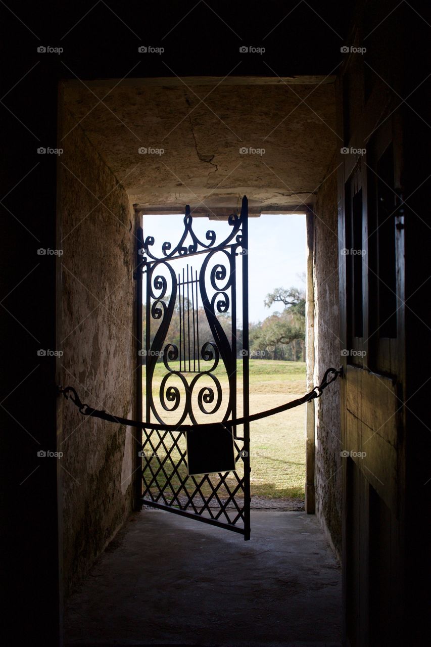 Wrought Iron Door looking out from the basement. Drayton Hall, Charleston, South Carolina.