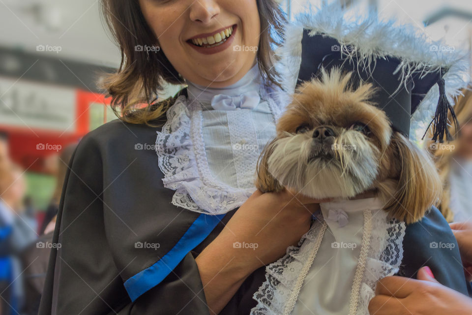 Girl graduating with her dog