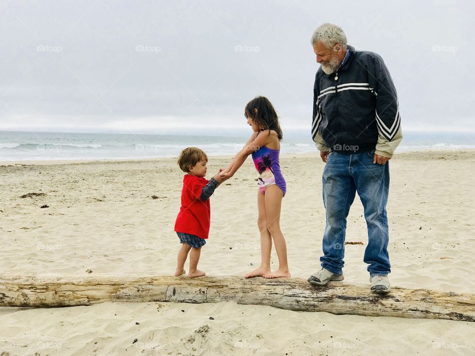 Awesome memories! On a log with grandpa at the beach