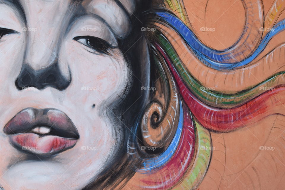 Woman's face painted on wall