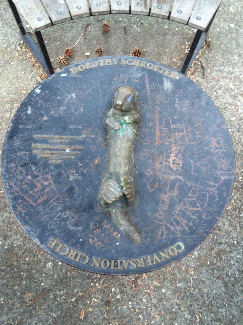 Park bench otter statue